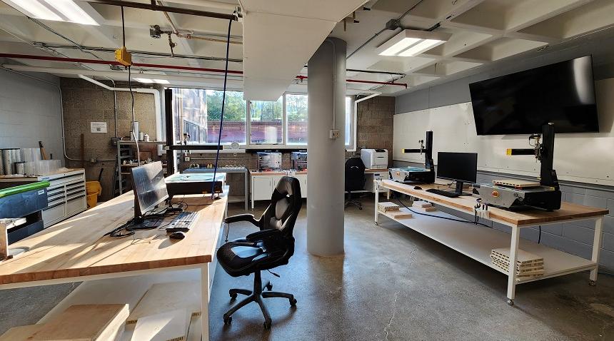 digital lab ceramic satellite interior view with computers and printing equipment on desks